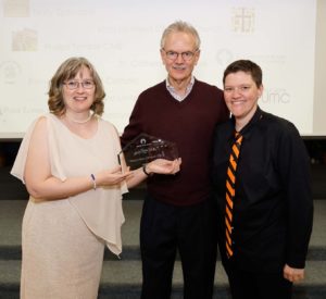 Pictured accepting the award are Pastor Rebecca Littlejohn, Chair of the Elders Michael Kinnamon, and Outreach Chair Julie Germain